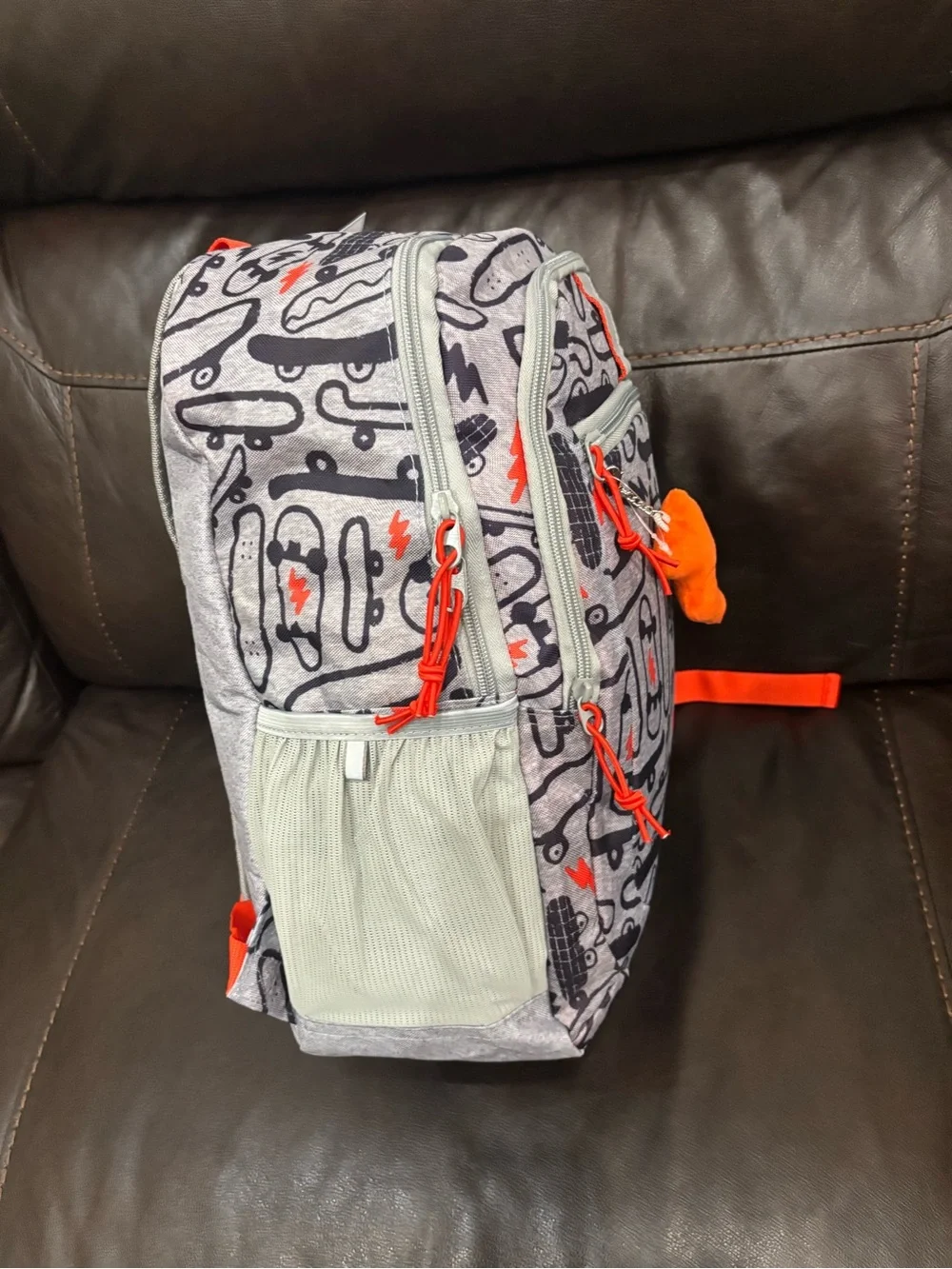 New with tags Kids Skateboard Print Backpack in Gray with Orange Accents
